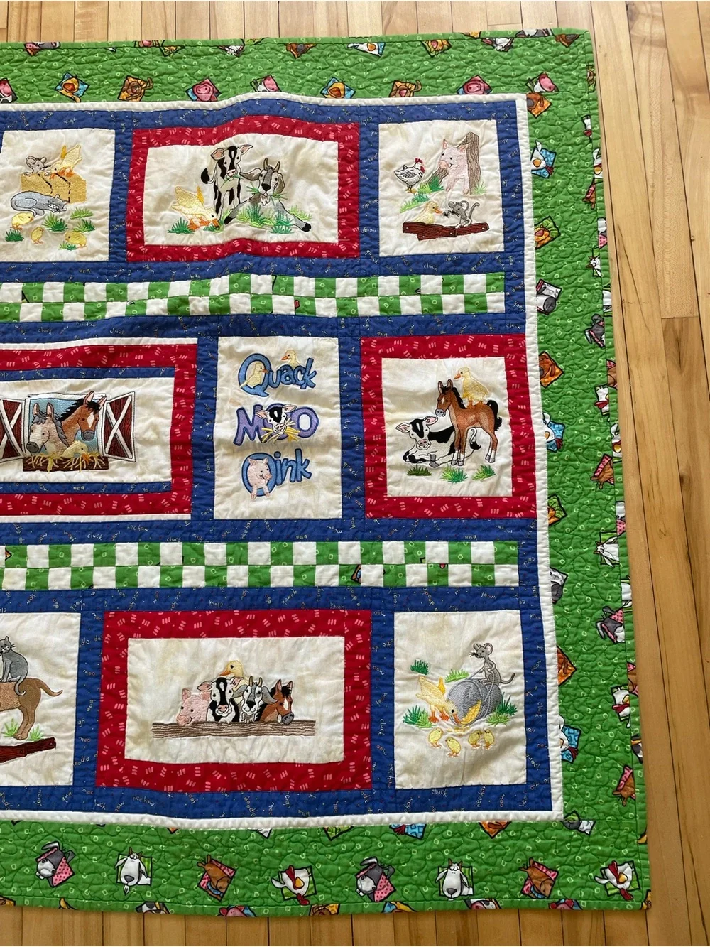 Quack, Moo, Oink quilt with farm animals and 'Quack, Moo, Oink'